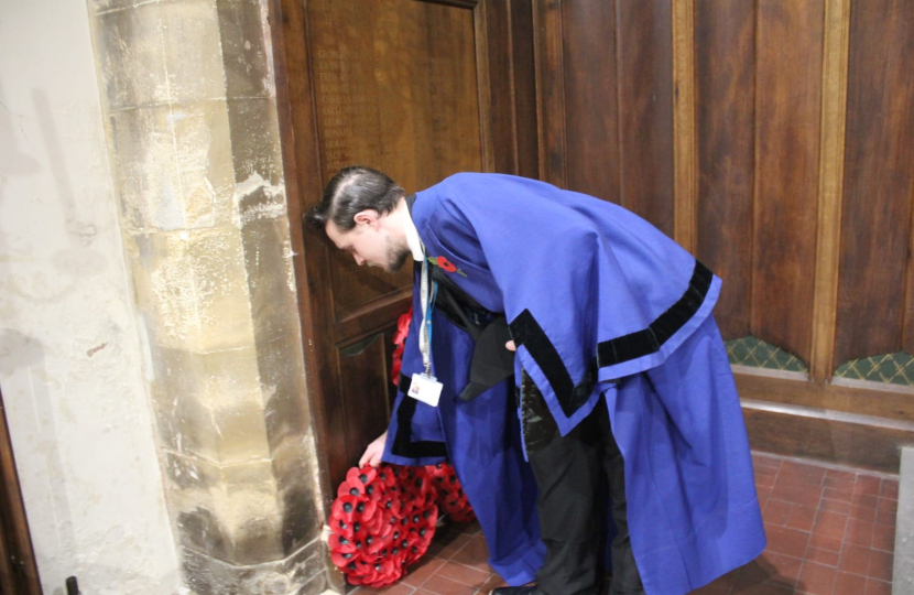 Matthew laying a wreath