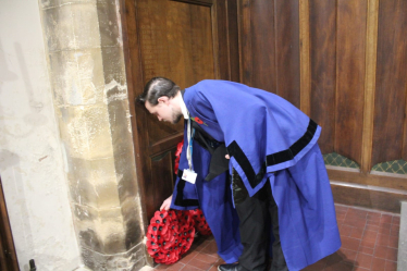 Matthew laying a wreath